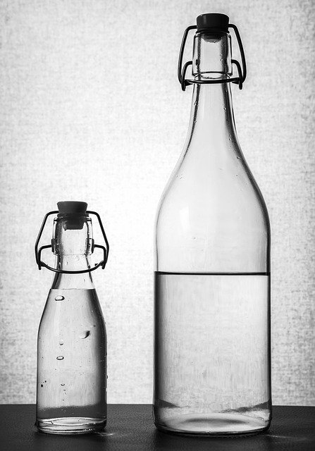 2 bottles of water packaged with glass bottles