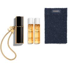 A 5ml mini Chanel N°5 spray included in a gift set or bought as a travel-friendly option.